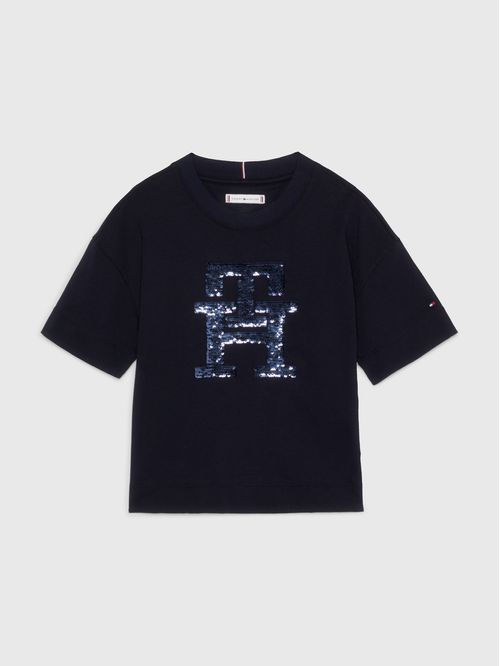 Remera con monograma TH de lentejuelas