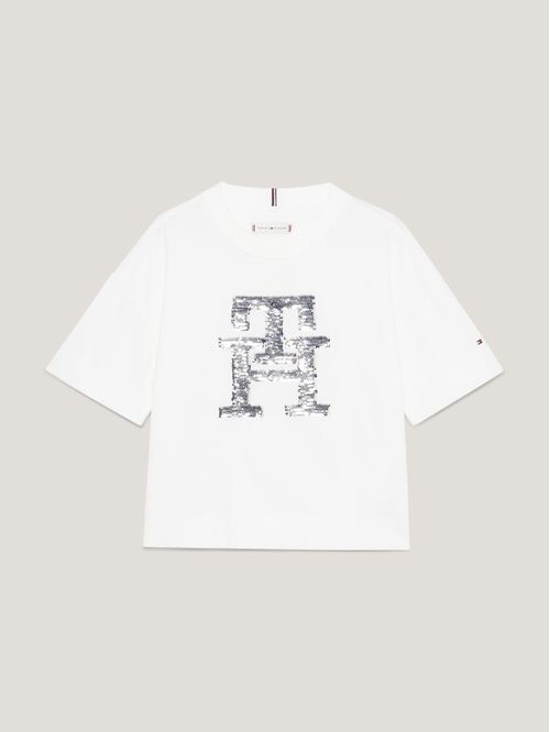 Remera con monograma TH de lentejuelas