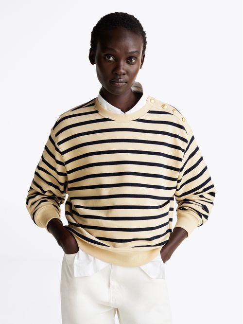 Buzo con botones de corte cropped